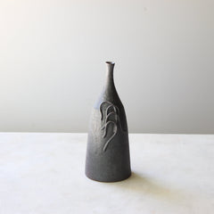 Metal and dust bottle with coils 1