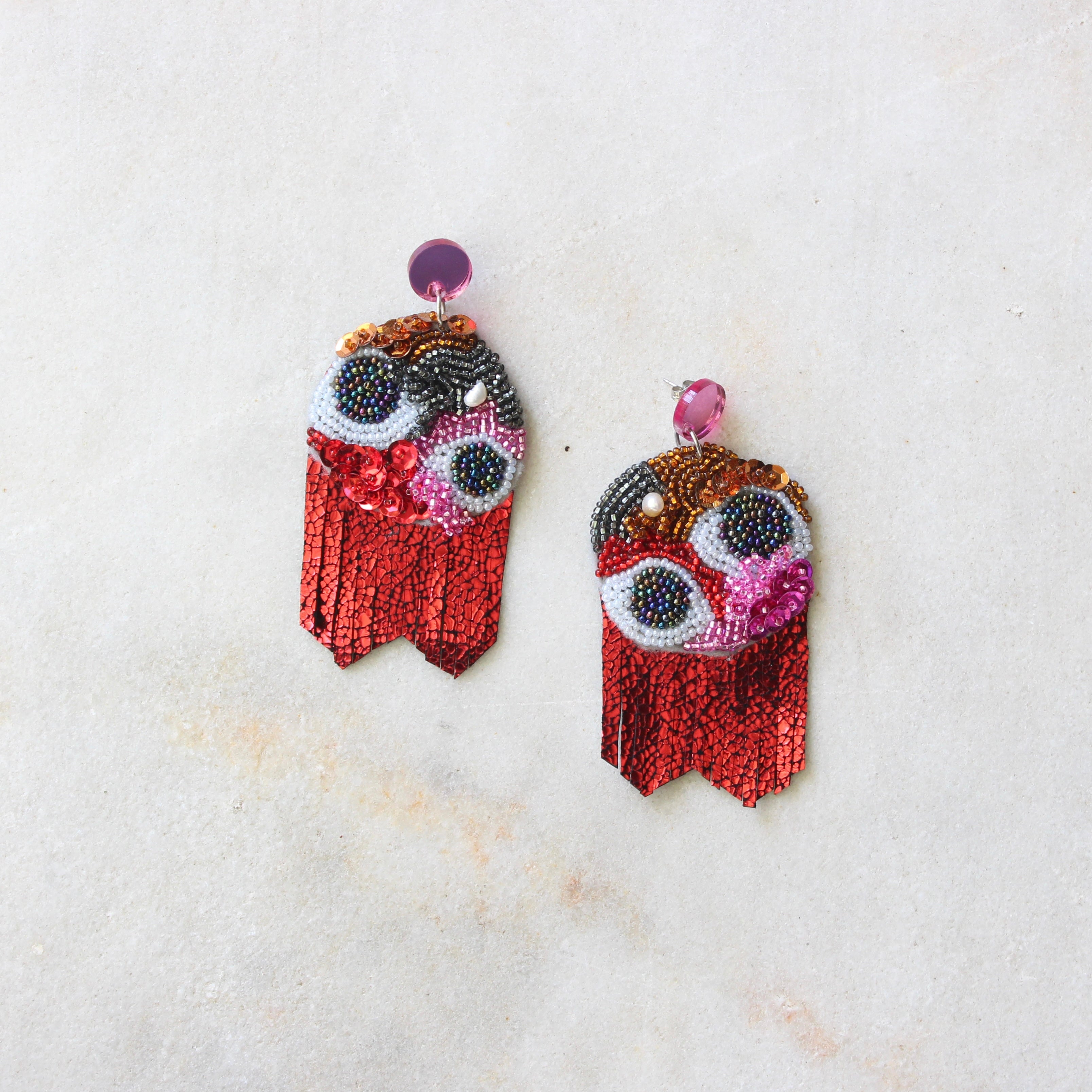 Beaded and leather earring - eyes and red tassels Jewellery Kimi Schieren 