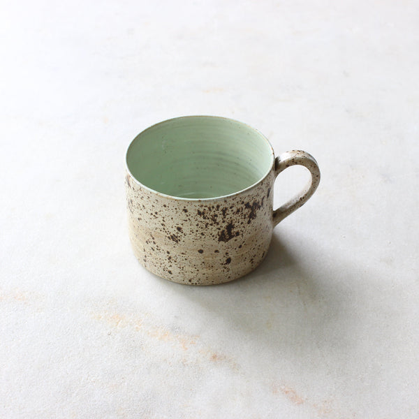 Speckled egg wide mug with melon green liner Ceramics D H Makers 