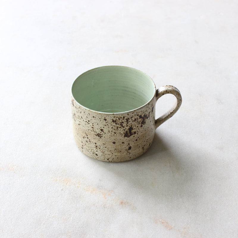 Speckled egg wide mug with melon green liner Ceramics D H Makers 